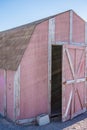 Old Faded red barn with peeling paint Royalty Free Stock Photo