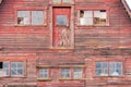 Old red barn with red broken window. Royalty Free Stock Photo