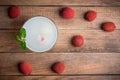 Old fahioned lychee cocktail on the rustic background Royalty Free Stock Photo