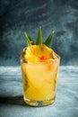 Old fahioned pineapple beverage on rustic background Royalty Free Stock Photo