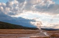 Old Faithful Geyser at dawn as seen from the Old Faithful Inn in Yellowstone National Park in Wyoming Royalty Free Stock Photo