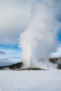 Old Faithful geyser erupting, winter, Yellowstone