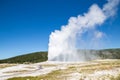 Old Faithful geyser eruption into Yellowstone National Park, USA Royalty Free Stock Photo