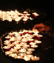 Old faithful hand lights a candle