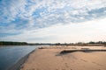 Old fallen trees in the sand by the shore of the Baltic Sea near Carnikava, Latvia Royalty Free Stock Photo