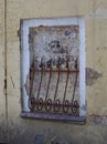 Old false window with decorative metal bars Royalty Free Stock Photo