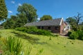 An old farm along a canal with lots of duckweed in Maasland, the Royalty Free Stock Photo