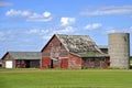 Old farm building stand idle in a deteriorating state Royalty Free Stock Photo
