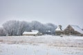 Old farm buildings with frosty trees and snow Royalty Free Stock Photo