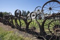 Old farm fence made of old rusty wagon & tractor wheels at the Artisans at the Dahmen Barn is on the Palouse Scenic Byway in Union Royalty Free Stock Photo