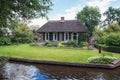 Old farm house along the canal in a small Dutch town Giethoorn Royalty Free Stock Photo