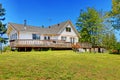 Old farm house with walkout deck. Backyard view