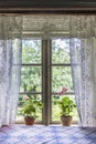 Old farm house window with lace curtains Royalty Free Stock Photo