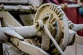 Old farm machinery on a farm. Root mechanisms and wheels in agricultural machinery from the last century. Royalty Free Stock Photo