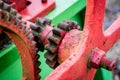 Old farm machinery on a farm. Root mechanisms and wheels in agricultural machinery from the last century. Royalty Free Stock Photo