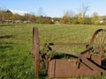 Old farm machinery left idle in the field Royalty Free Stock Photo