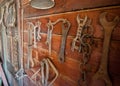 Old farm tools hung on a wall Royalty Free Stock Photo