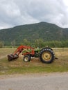 Old Farm Tractor by the Road Royalty Free Stock Photo