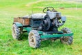 An old farm tractor with a wooden trailer Royalty Free Stock Photo