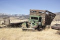 Old farm truck in a field of junk Royalty Free Stock Photo