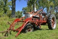 Old Farmall tractor with front end loader