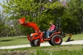 Old Farmer Plowing His Compact Tractor Royalty Free Stock Photo