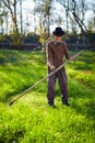 Old farmer with scythe