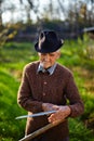 Old farmer sharpening scythe Royalty Free Stock Photo