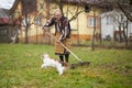 Old farmer woman cleaning with a rake Royalty Free Stock Photo