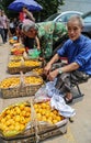 Old farmers selling loquat in the market in chengdu,china Royalty Free Stock Photo