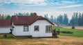 Typical North American Country Farm House on sunny day. Farm yard with the plowed field in front Royalty Free Stock Photo