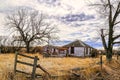 Old Farmhouse on rundown property with Broken Fence