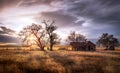 Old Farmhouse at Sunset On a Meadow