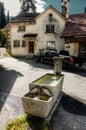 Old farmhouse and trough in the Swiss village of Berschis, Walenstadt Royalty Free Stock Photo