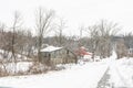 Old farmstead on a lonely snow-covered road Royalty Free Stock Photo