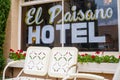 Old fashion metal lawn chairs decorate the patio of the historic El Paisano Hotel in Marfa, Texas.