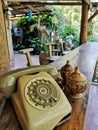 Old fashion phones and coconut shell coffee cups