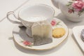 Cup of tea and biscuit with tradtional tea set Royalty Free Stock Photo