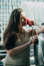 Old fashion town. Vintage concept. Woman with payphone. Communication. Oldstyled city.