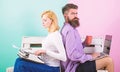 Old fashioned against modern, outdated against new. Man work use modern stylish laptop and woman work retro typewriter Royalty Free Stock Photo