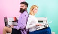 Old fashioned against modern, outdated against new. Man work use modern stylish laptop and woman work retro typewriter Royalty Free Stock Photo