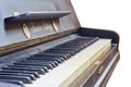 Old-fashioned antique ornamental piano with carved pillars. After restoration
