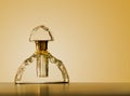 Old fashioned, antique perfume bottle, with gold top and background