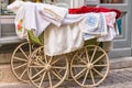 Old-fashioned baby carriage with wooden wheels