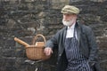 Old fashioned 1940 baker with bread basket