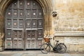 Old Fashioned Bicycle Outside Oxford University College Building Royalty Free Stock Photo