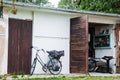 Old fashioned bicycle and a small garage