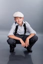 Old fashioned boy sitting Royalty Free Stock Photo