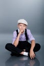 Old fashioned boy sitting Royalty Free Stock Photo