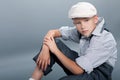 Old fashioned boy sitting Royalty Free Stock Photo